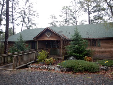 Idyllic Lakefront Log Cabin with Hot Tub and Boat Dock on Lake Ouachita Marina in Mount Ida, Arkansas - glamping.directory