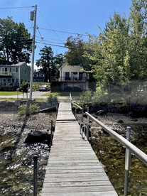 Cozy Lake Front Cabin with Private Beach Access and Stunning Views of Sebago Lake in Frye Island, Maine - Standish, Maine - glamping.directory