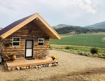 Secluded Off-Grid Log Cabin Rental with Wood-Burning Stove near Steamboat Springs, Colorado - glamping.directory