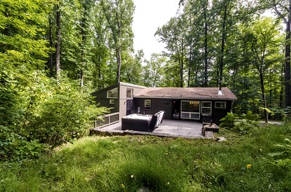 Cozy Colorful Cabin with Hot Tub and Screened-In Porch Close to Many Local Favorites in Berkeley Springs, WV - glamping.directory