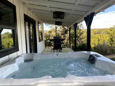 The Ultimate Romantic Getaway: Charming Cabin with a Hot Tub in Wimberley, Texas - Wimberley, Texas - glamping.directory