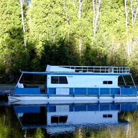 Versatile Sportsman Houseboat with Wraparound Fishing Deck & Water Slide Near Babbitt, MN - glamping.directory