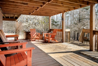 Extraordinary Group Retreat with Hot Tub, Fire Pit, Wraparound Deck in Great Cacapon, WV - Great Cacapon, West Virginia - glamping.directory