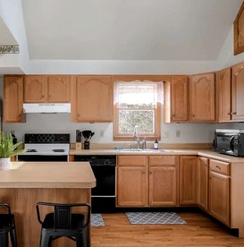 Extraordinary Group Retreat with Hot Tub, Fire Pit, Wraparound Deck in Great Cacapon, WV - Great Cacapon, West Virginia - glamping.directory