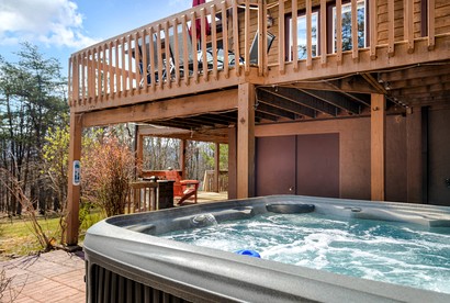 Extraordinary Group Retreat with Hot Tub, Fire Pit, Wraparound Deck in Great Cacapon, WV - Great Cacapon, West Virginia - glamping.directory
