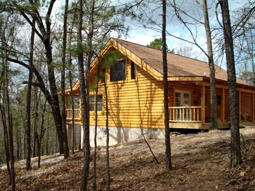 Peaceful and Spacious Log Cabin Rental with Woodland Views near Branson, Missouri - glamping.directory