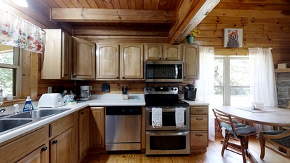 Elevate Your Tennessee Glamping Escape in this Lovely Riverside Cabin Rental in Newport - Newport, Tennessee - glamping.directory