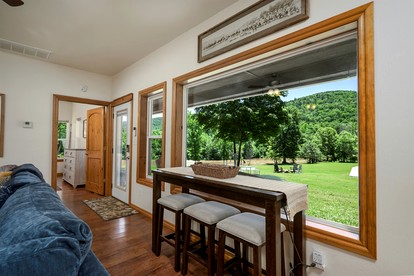 Enchanting Riverside Cabin Retreat with Mountain Views near Sardis Lake Oklahoma - Nashoba, Oklahoma - glamping.directory