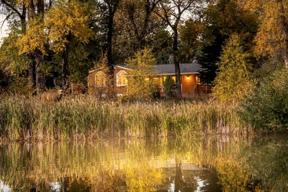 Spacious Retreat with Stone Fireplace & Pond Views in Banner, Wyoming - Banner, Wyoming - glamping.directory