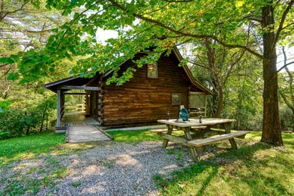 Escape to Logan, Ohio, in this Wonderful Log Cabin for Four with a Hot Tub and Pond - glamping.directory