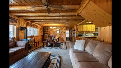 Rustic Cabin Retreat with Private Pond & Hot Tub near Island Park, Idaho - Island Park, Idaho - glamping.directory