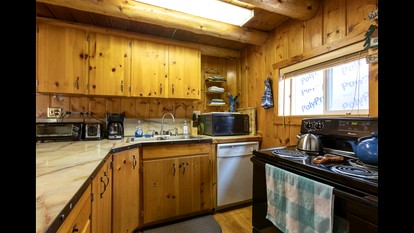 Rustic Cabin Retreat with Private Pond & Hot Tub near Island Park, Idaho - Island Park, Idaho - glamping.directory