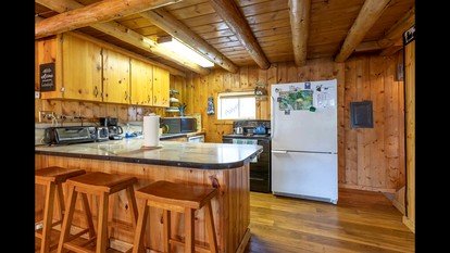 Rustic Cabin Retreat with Private Pond & Hot Tub near Island Park, Idaho - Island Park, Idaho - glamping.directory