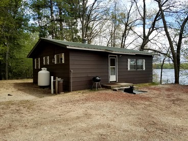Charming Vacation Cabin with Waterfront Views on Pine Lake, Michigan - Wellston, Michigan - glamping.directory