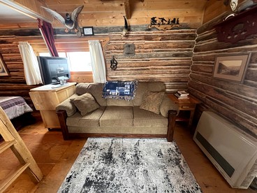 Charming Log Cabin with Mountain Views near Trails in Pony, Montana - Pony, Montana - glamping.directory
