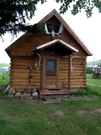 Charming Log Cabin with Mountain Views near Trails in Pony, Montana - glamping.directory