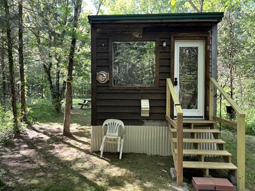 Peaceful Tiny Cabin Escape with Loft, Private Trail & Forest Views in Columbia, Tennessee - glamping.directory