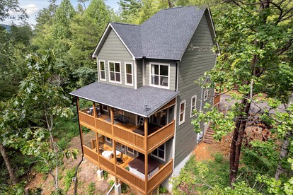 Impressive Cabin Retreat with Game Room and Beautiful Exterior Living Space in Sevierville, Tennessee - glamping.directory