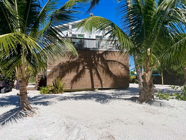 Charming Beachfront Cottage with Dock Slip and Kayaks on Little Gasparilla Island | Placida, FL - glamping.directory