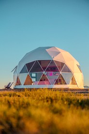 Luminous Cozy Dome with a Barbie Collection Above Bed in Willcox, Arizona - glamping.directory