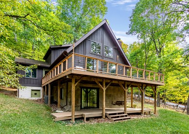 Peaceful Chalet-Cabin with a Private Lake, Hot Tub, Fire Pit and Deck at this Berkeley Springs, WV Getaway - glamping.directory