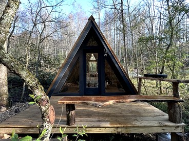 Secluded Off-Grid Cabin Retreat with Fire Pit & Sauna in Zirconia, North Carolina - glamping.directory