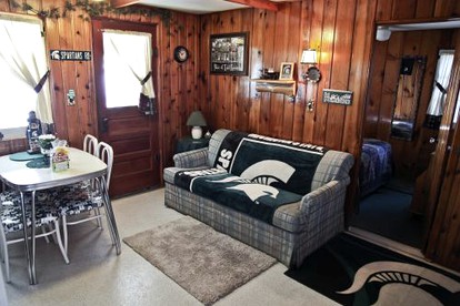 Fascinating Cabin with Foosball and Air Hockey Table in Carp Lake, Michigan - Carp Lake, Michigan - glamping.directory