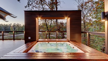 Hot Springs Retreat: Luxe Tented Cabin with Waterfront Views and Hot Tub - Hot Springs, Arkansas - glamping.directory