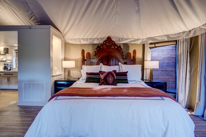 Hot Springs Retreat: Luxe Tented Cabin with Waterfront Views and Hot Tub - Hot Springs, Arkansas - glamping.directory