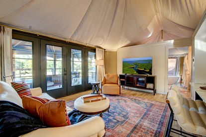 Hot Springs Retreat: Luxe Tented Cabin with Waterfront Views and Hot Tub - Hot Springs, Arkansas - glamping.directory