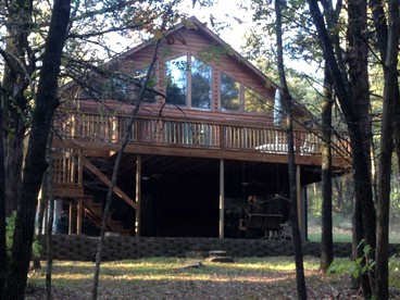 Spacious Lakefront Camping Cabin with Private Dock near Petit Jean State Park, Arkansas - glamping.directory