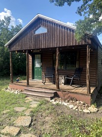 Cozy Texas Cabin Retreat with Hot Tub & Scenic Outdoor Spaces in Bluff Dale, Texas - glamping.directory