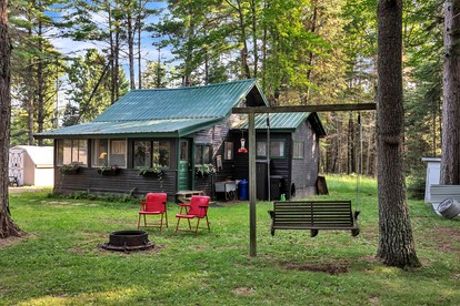 Secluded Cabin Nestled Amidst Trees and Fire Pit Provided in Hazelhurst, Wisconsin - glamping.directory
