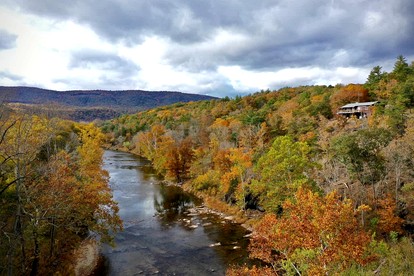 Secluded, Solar Powered Log Cabin on the Great Cacapon River, Perfect for Large Group Getaways to the West Virginia Wilderness - Great Cacapon, West Virginia - glamping.directory