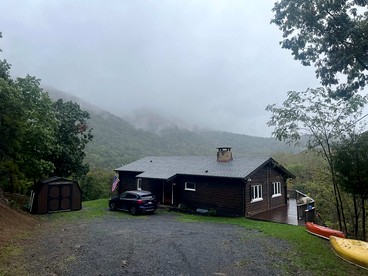 Secluded, Solar Powered Log Cabin on the Great Cacapon River, Perfect for Large Group Getaways to the West Virginia Wilderness - Great Cacapon, West Virginia - glamping.directory