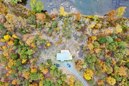 Secluded, Solar Powered Log Cabin on the Great Cacapon River, Perfect for Large Group Getaways to the West Virginia Wilderness - Great Cacapon, West Virginia - glamping.directory