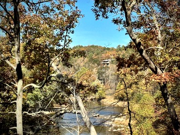 Secluded, Solar Powered Log Cabin on the Great Cacapon River, Perfect for Large Group Getaways to the West Virginia Wilderness - Great Cacapon, West Virginia - glamping.directory