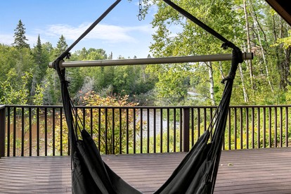 Riverfront Cabin Incredible for Outdoor Enthusiasts with Kayaks in Hessel, Michigan - glamping.directory