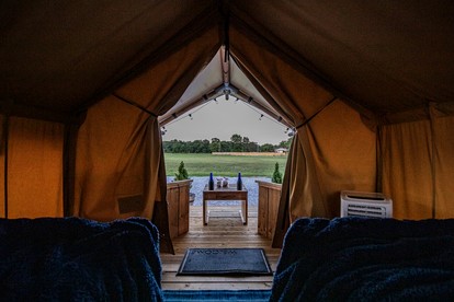 Comfortable Glamping Tent with Fire Pit and Stream Access Near Mark Twain National Forest in Missouri - Cassville, Missouri - glamping.directory