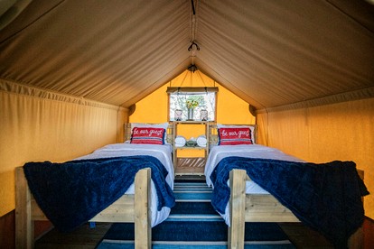 Comfortable Glamping Tent with Fire Pit and Stream Access Near Mark Twain National Forest in Missouri - Cassville, Missouri - glamping.directory