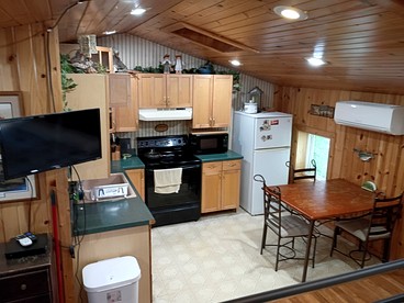 Cozy Riverside Cabin Rental with Fishing Access on Wolf River, Wisconsin - Fremont, Wisconsin - glamping.directory