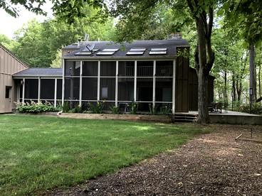 Secluded Woodland Retreat Home with Creekside Deck Near Macatawa Beach in Macatawa, Michigan - glamping.directory