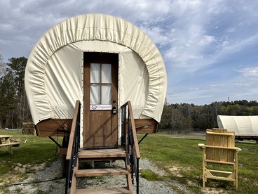 Go Glamping in North Carolina at this Wonderful Riverside Covered Wagon in Lillington - glamping.directory