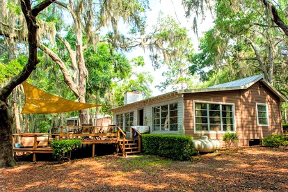 Spacious Cabin for a Group Getaway Overlooking Junior Lake in Florida - glamping.directory