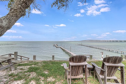 Stylish Waterfront Vacation Rental with Boat Dock and Golf Course in Rockport, Texas - Rockport, Texas - glamping.directory