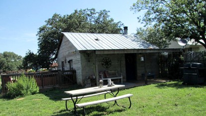Romantic Rustic Cabin with Hot Tub on Working Ranch in Fredericksburg, Texas - glamping.directory