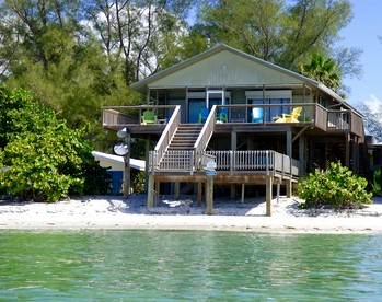 Stunning Secluded Beach House Right on the Sand for the Ultimate Relaxing Escape by the Coast on Little Gasparilla Island, Florida - glamping.directory