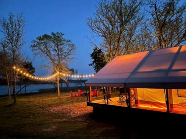 Romantic Lakefront Safari Tent with Fire Pit and Peaceful Views near Bastrop, Texas - glamping.directory