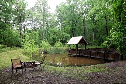 Romantic Cabin Getaway for Two with Hot Tub, Pond & Western Charm in Beavers Bend - Broken Bow, Oklahoma - glamping.directory