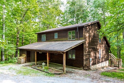 Spacious Cabin Retreat with Hot Tub, Fire Pit, Large Deck and Access to Community Pool and Other Amenities at this Berekely Springs, WV Getaway - glamping.directory
